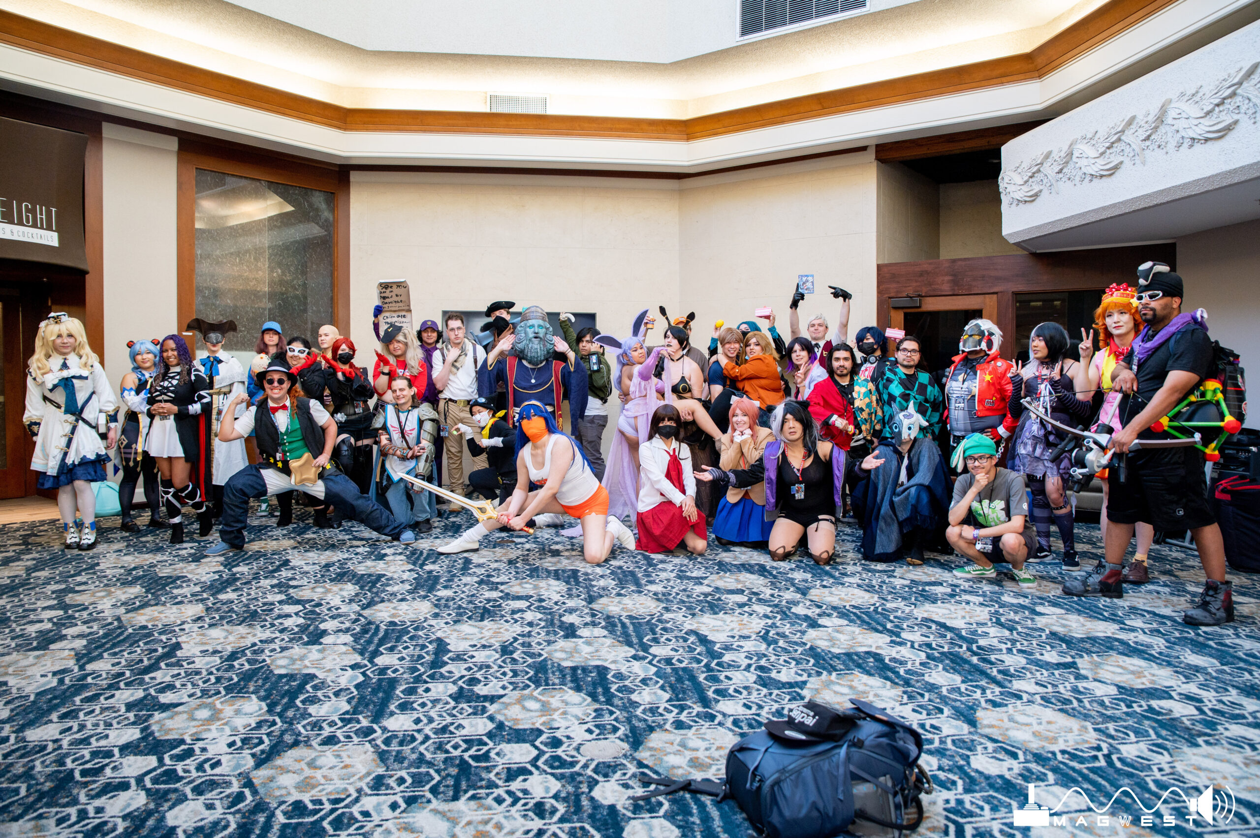 Group photo of a cosplay gathering of multiple fandoms such as Nintendo, hoyoverse, Persona and many others.